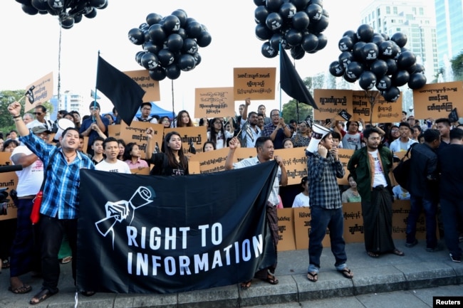 FILE - Myanmar press freedom advocates and youth activists hold a demonstration demanding the freedom of two jailed Reuters journalists Wa Lone and Kyaw Soe Oo in Yangon, Myanmar, Sept. 16, 2018.
