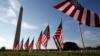 FILE - U.S. flags representing suicides of active and veteran members of the military line the National Mall in Washington, Oct. 3, 2018. U.S. suicide rates have been rising for nearly 20 years, aside from a two-year drop around the beginning of the COVID-19 pandemic.