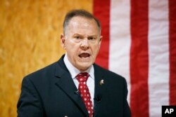 FILE - former Alabama Chief Justice and U.S. Senate candidate Roy Moore speaks at a campaign rally, in Dora, Ala.