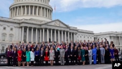 Members of the freshman class of Congress pose for a photo on Capitol Hill in Washington, Nov. 14, 2018, in Washington.