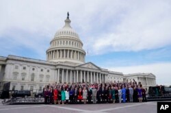 Members of the freshman class of Congress pose for a photo on Capitol Hill in Washington, Nov. 14, 2018, in Washington.