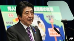 Japanese Prime Minister Shinzo Abe speaks during a press conference at his official residence in Tokyo, July 1, 2014. 