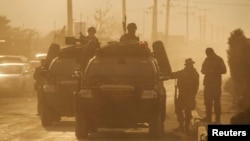 FILE - Members of the Afghan special forces are seen near an election commission office during an attack by gunmen in Kabul.