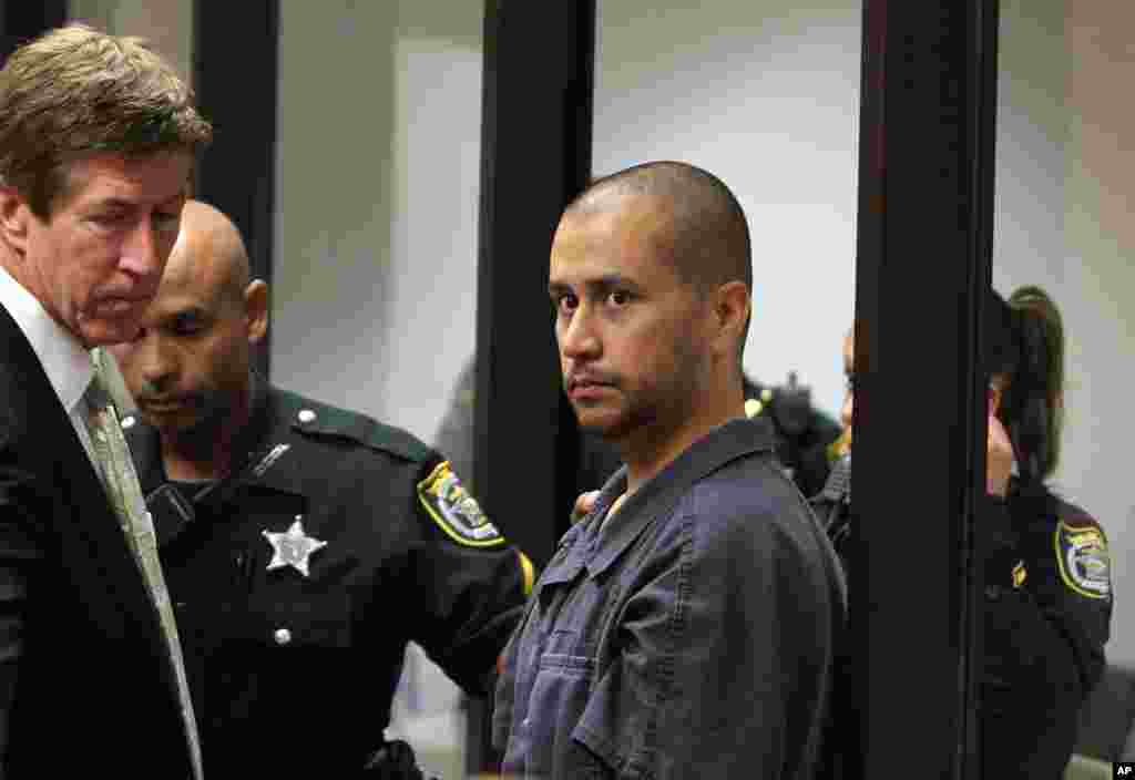 April 12: George Zimmerman, charged with second-degree murder in the shooting death of the 17-year-old Trayvon Martin, is directed by a Seminole County Deputy and his attorney Mark O&#39;Mara during a court hearing in Sanford, Florida.