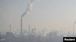 Smog billows from chimneys and cooling towers of a steel plant during hazy weather in Taiyuan, Shanxi province, China, Dec. 28, 2016. 