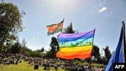 FILE: People gather for a peace meeting between members of the Kirinyaga, Kenya and Kalenjin tribes in Eldoret, Kenya. Violence erupted with accusations that by then-opposition leader Raila Odinga that President Mwai Kibaki had stolen the December 2007 elections. Taken 6.27.2009