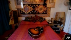 The bed in the former bedroom of U.S. musician Jimi Hendrix at the central London flat he used to live in at 23 Brook Street, London, Monday, Feb. 8, 2016. (AP Photo/Matt Dunham)