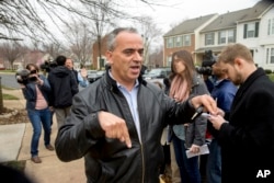 Jamal Khweis who identified himself as the father of Mohamad Jamal Khweis, a member of the Islamic State group who gave himself up to Iraqi Kurdish forces in northern Iraq on Monday, outside his home in Alexandria, Va., March 14, 2016.