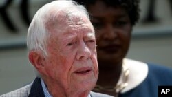 FILE- Former President Jimmy Carter speaks during a news conference, in Plains, Ga., Sept. 18, 2018. 