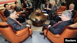 South Korea - Russia's Deputy Foreign Minister and North Korean nuclear envoy Alexei Borodavkin (front R) talks with the South Korean envoy for six-party talks, Wi Sung-lac, (front L) in Seoul, January 28, 2011