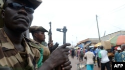 Members of the Multinational Force of Central Africa (FOMAC) patrol on July 20, 2013 in Bangui.