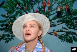 FILE - U.S. singer Madonna speaks at a news conference in Blantyre, Malawi, July 16, 2018.