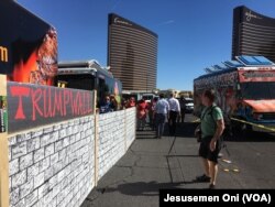 Taco trucks form the Wall of Tacos demonstration in front of the Trump International Hotel Las Vegas before the last 2016 U.S. presidential debate in Las Vegas, Nevada, Oct. 19, 2016.