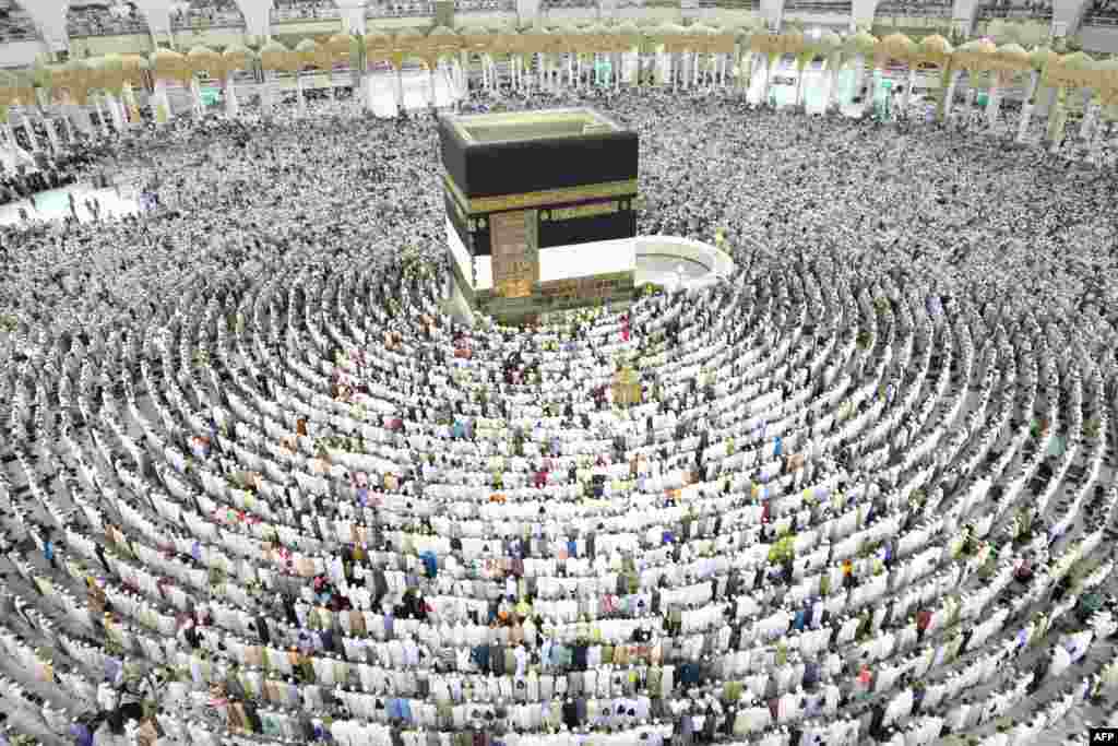 Muslim worshipers perform prayers around the Kaaba, Islam&#39;s holiest shrine, at the Grand Mosque in Saudi Arabia&#39;s holy city of Mecca, Aug. 15, 2018, prior to the start of the annual Hajj pilgrimage in the holy city.