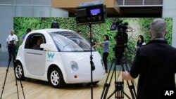 The Waymo driverless car is displayed during a Google event, Tuesday, Dec. 13, 2016, in San Francisco.