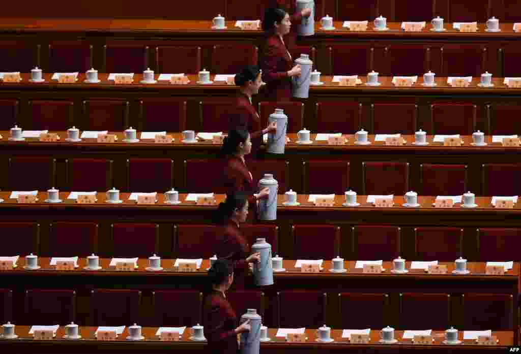 Attendants prepare tea for Chinese leaders before the closing session of the Chinese People&#39;s Political Consultative Conference (CPPCC) at the Great Hall of the People in Beijing.