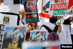 Protesters hold a rally outside the U.S. Embassy in Jakarta, Indonesia, to condemn the U.S. decision to recognize Jerusalem as Israel's capital, Dec. 10, 2017.