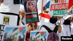 Protesters hold a rally outside the U.S. Embassy in Jakarta, Indonesia, to condemn the U.S. decision to recognize Jerusalem as Israel's capital, Dec. 10, 2017.