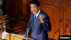 Japan's Prime Minister Shinzo Abe delivers his policy speech at the lower house of parliament in Tokyo, Oct. 24, 2018.