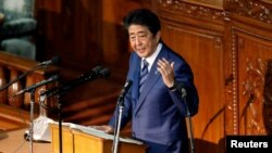 FILE - Japan's Prime Minister Shinzo Abe speaks in the lower house of parliament in Tokyo, Oct. 24, 2018.