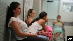 FILE - Six-weeks pregnant Daniela Rodriguez, 19, waits for test results after being diagnosed with the Zika virus at Erasmo Meoz Hospital in Cucuta, the capital of Norte de Santander state, home to most of the Colombia's Zika virus cases, Feb. 11, 2016. 