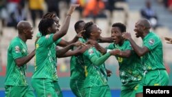 FILE: Zimbabwe's Kudakwashe Mahachi celebrates scoring their second goal with teammates in the match against Guinea; Cameroon, Jan. 18, 2022.
