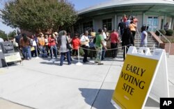 Voters line up during early voting at Chavis Community Center in Raleigh, North Carolina, Oct. 20, 2016.