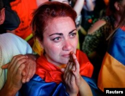 A supporter of Armenian opposition leader Nikol Pashinyan reacts, after his bid to be interim prime minister was blocked by the parliament, during a rally in central Yerevan, Armenia, May 1, 2018.