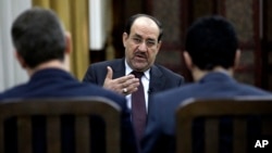 Iraq's Prime Minister Nouri al-Maliki speaks during an interview with The Associated Press in Baghdad, Feb. 27, 2013. 
