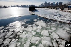 Sea ice floats in Boston Harbor Jan. 3, 2018, in Boston. After a week of frigid temperatures, a major winter storm is predicted for the region on Thursday.