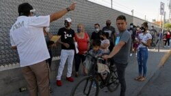 MEXICO – Cuban migrants coming from the United States queue to renew the permit to remain in Mexico while U.S. authorities handle entrance requests under the Migrant Protection Protocols (MPP), in Ciudad Juarez, Mexico. Taken on July 08, 2020.