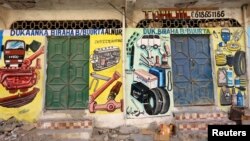 A mural showing spare parts for vehicles is seen on a wall of a shop in Hodan district of Mogadishu, Somalia, June 10, 2017. 