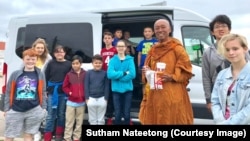 Buddhist monk Sutham Nateetong is walking across the USA to promote peace