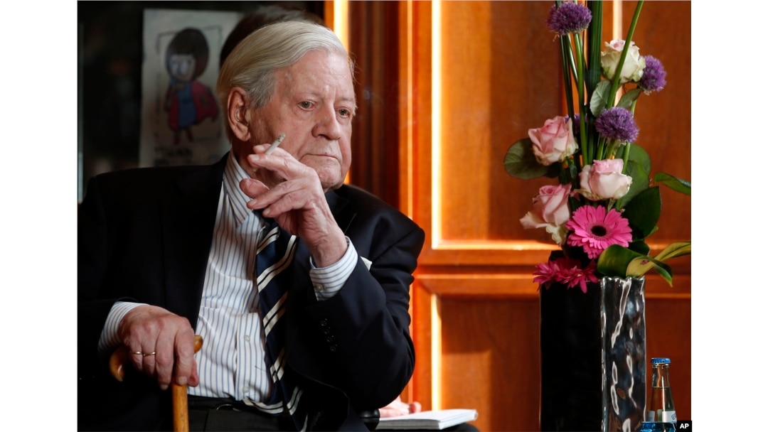 FILE - Former West German Chancellor Helmut Schmidt attends a meeting with the Prime Minister of China, Li Keqiang, unseen, in Berlin, Germany, May 27, 2013.