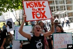 Demonstrators protest outside the Comcast Center in Philadelphia, July 27, 2016, during the third day of the Democratic National Convention.