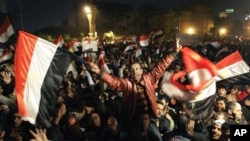 Egyptians celebrate the news of the resignation of President Hosni Mubarak, Feb 11, 2011