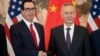 China's Vice Premier Liu He, right, shakes hands with U.S. Treasury Secretary Steven Mnuchin as they pose for a photo at the Diaoyutai State Guesthouse in Beijing, March 29, 2019.