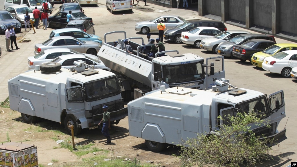 FILE - Zimbabwean riot police with water cannons are seen parked in Harare, Oct. 11, 2018. Lawyers say police in the country have arrested dozens of trade union members ahead of a planned protest in the capital over the worst economic crisis in a decade.