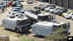 FILE - Zimbabwean riot police with water cannons are seen parked in Harare, Oct. 11, 2018. Lawyers say police in the country have arrested dozens of trade union members ahead of a planned protest in the capital over the worst economic crisis in a decade.