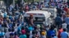 Mourners shout slogans during the funeral procession for slain school principal Supinder Kour, in Srinagar, Indian-administered Kashmir, Oct. 8, 2021.