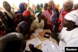 People register for a Darfur referendum, on whether to remain as five states or merge into one, at a registration centre at Abo-Shouk IDPs camp at Al Fashir in North Darfur, Sudan, Feb. 17, 2016.