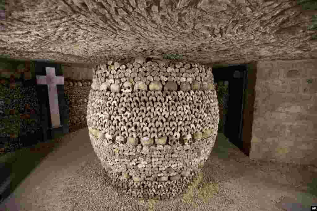 Skulls and bones are stacked at the Catacombs in Paris, France. The subterranean tunnels, stretching 2 kilometers (1.24 miles), cradle the bones of some 6 million Parisians from centuries past and once gave refuge to smugglers. 