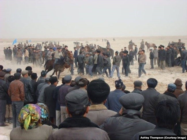 FILE - Ethnic Uyghurs compete in horse racing at a Nowruz event outside the city of Kuqa, in China's Xinjiang Uyghur Autonomous Region, March 21, 2011. (Photo by Ashley Thompson)