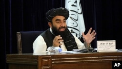 Пресс-секретарь Талибана Забиулла Муджахид на пресс-конференции в Кабуле 7 сентября 2021 г. объявил о временном кабинете