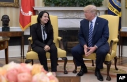 President Donald Trump meets with Aya Hijazi, an Egyptian-American aid worker, in the Oval office of the White House in Washington, April 21, 2017.