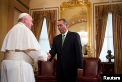 Speaker of the House John Boehner, R-Ohio (R) meets Pope Francis in the U.S. Capitol building as the Pope arrives to deliver his speech to a joint meeting of Congress in Washington D.C., Sept. 24, 2015.