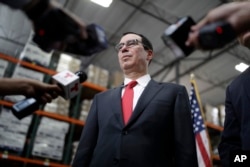 FILE - Treasury Secretary Steven Mnuchin speaks at a news conference, Aug. 28, 2017, in Las Vegas.