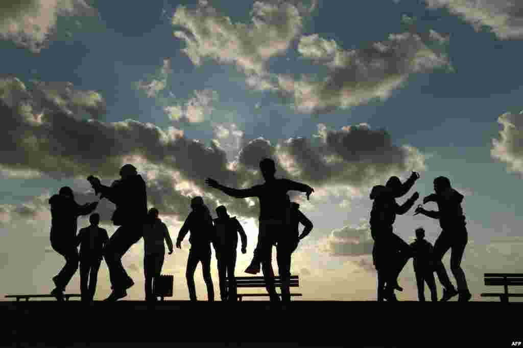 Palestinians celebrate the last day of the year at the sea port in Gaza City, Dec. 31, 2015.