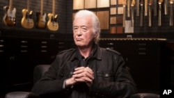 Jimmy Page poses for a portrait at the Fender Factory in Corona, Calif., Oct. 10, 2018.