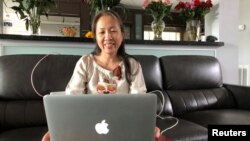 Nguyen Ngoc Nhu Quynh, who goes by the pen name Mother Mushroom, speaks with a reporter during a video conference on her laptop computer in Houston, Texas, October 19, 2018.